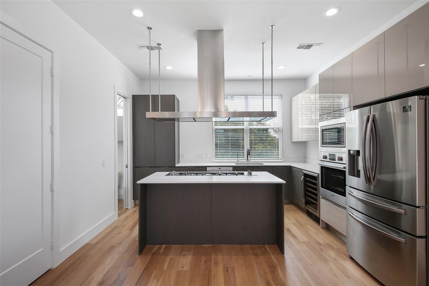 Modern kitchen with a center island and stainless steel appliances at 4904 Lexington Ct, Dallas