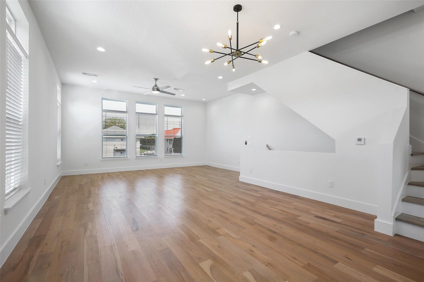 Bright living room with high ceilings and large windows at 4904 Lexington Ct, Dallas