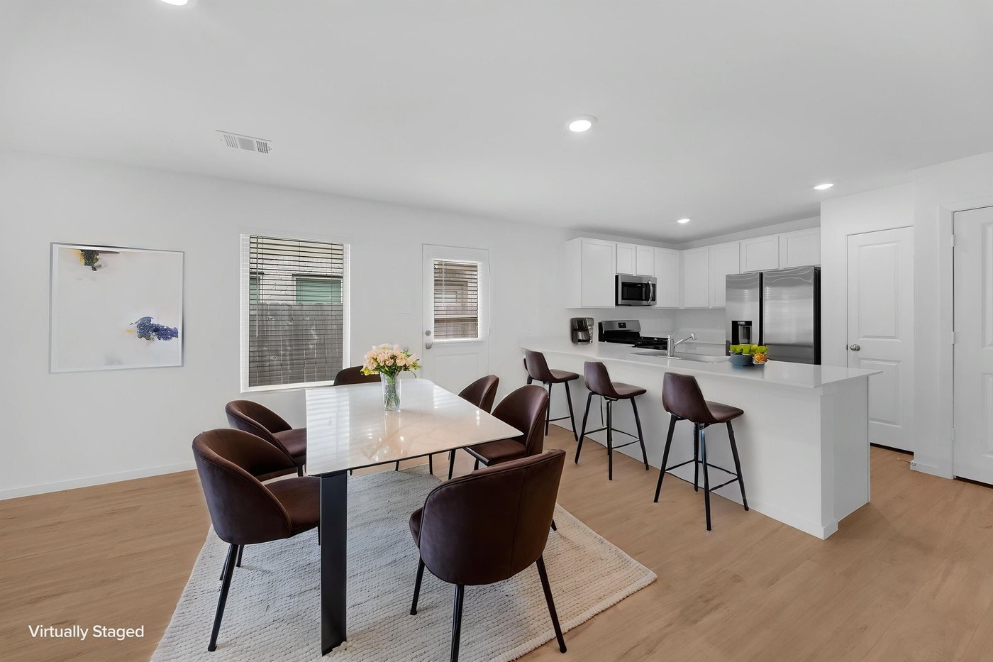 Dining area open to the kitchen at 597 Falling Cave Dr, Willis