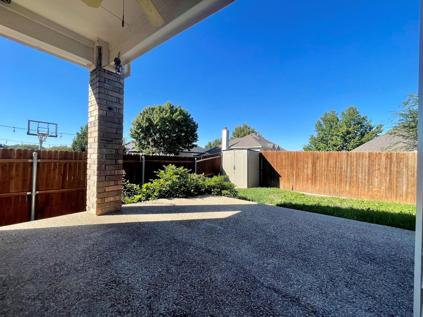 Covered back patio and fenced yard at 6505 Josephine Dr, Arlington
