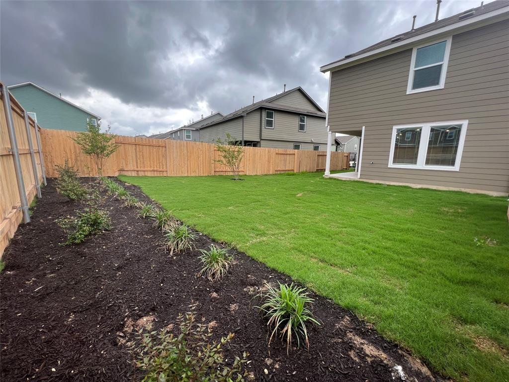 Fenced backyard at 7724 Spotted Leaf Way in Del Valle