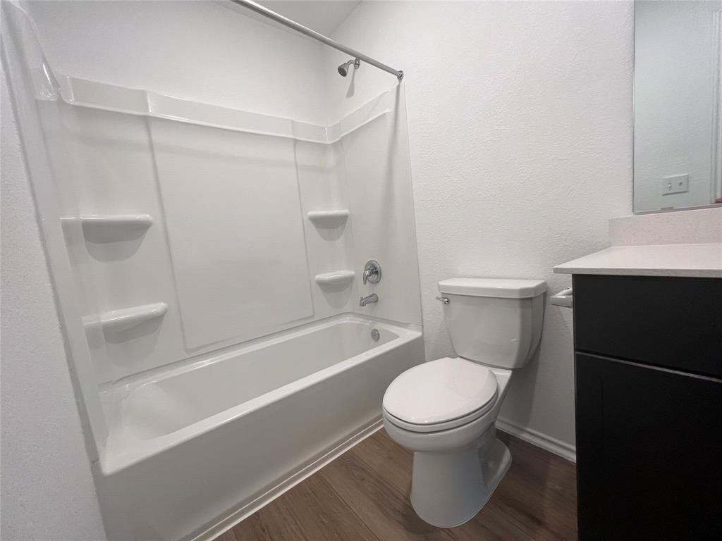 Second full bathroom with tub and shower at 7724 Spotted Leaf Way in Del Valle