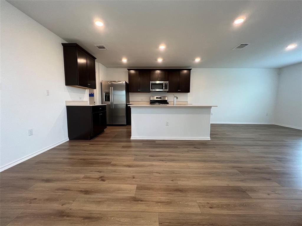 Kitchen with modern appliances and sleek countertops at 7724 Spotted Leaf Way in Del Valle