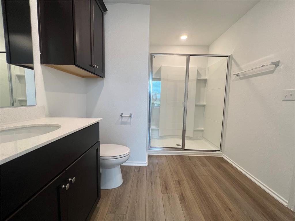 Primary bathroom with a glass enclosed shower at 7724 Spotted Leaf Way in Del Valle