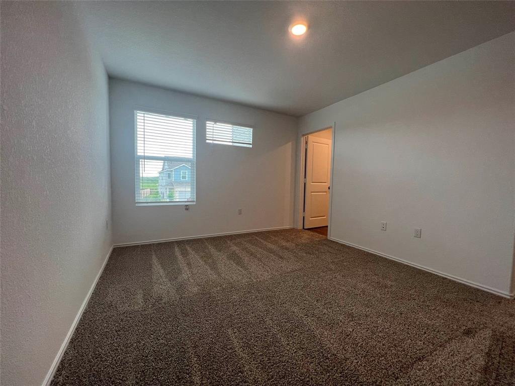 Primary suite upstairs at 7724 Spotted Leaf Way, Del Valle TX